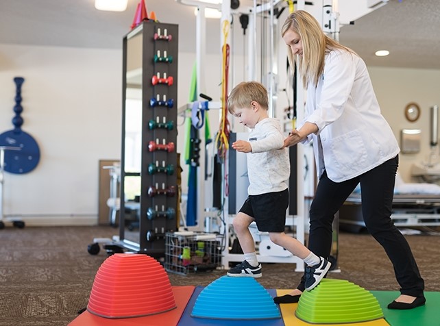 Paediatric physiotherapist working with a child in Kogarah