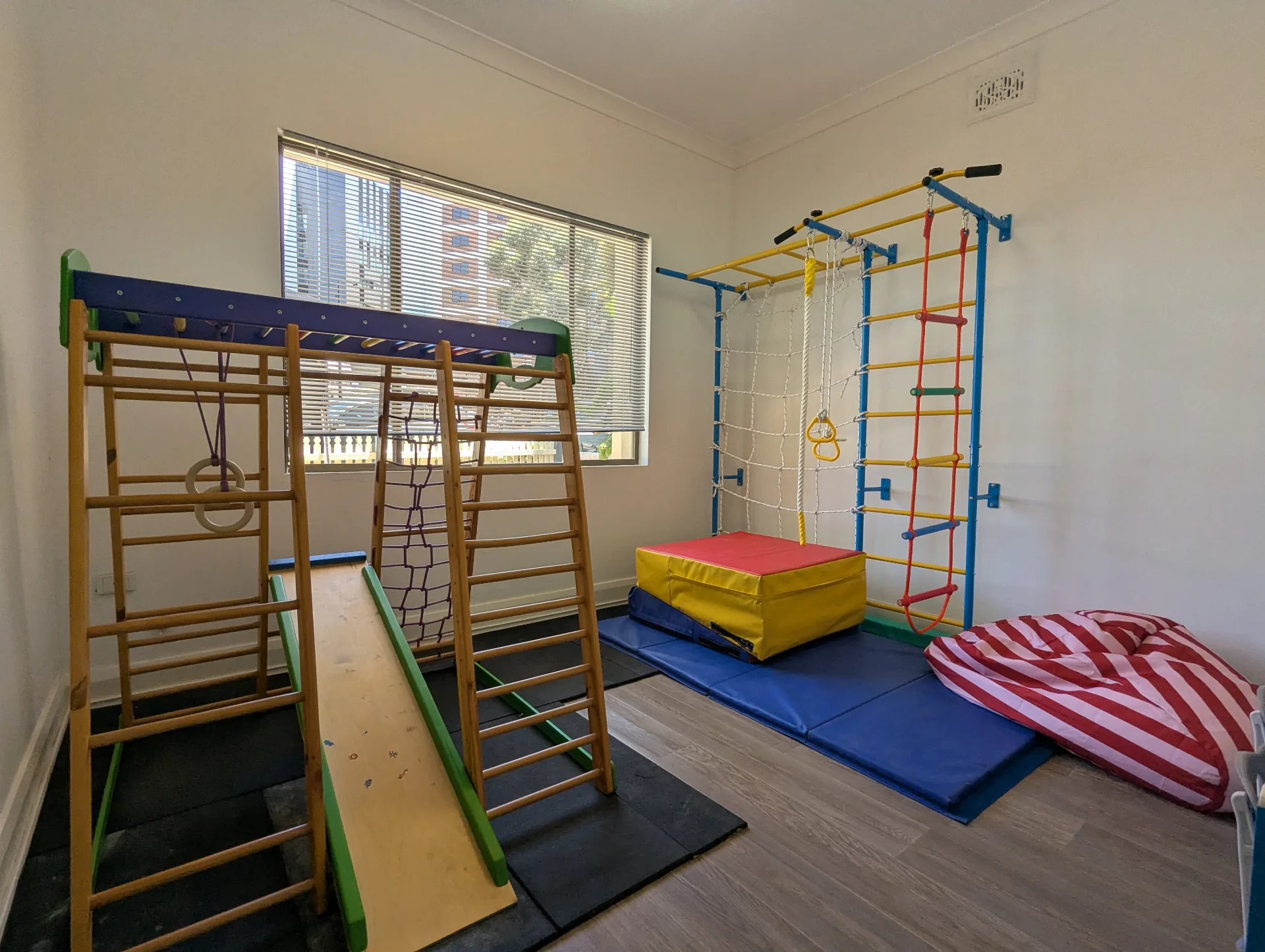 Climbing frame, ladders, rings and crash mats used for paediatric physiotherapy at Square One