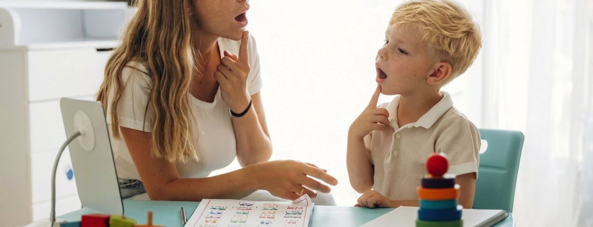 Children laughing together in a paediatric speech therapy session