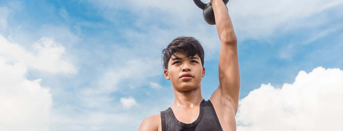 Adolescent doing strength training with a physiotherapist